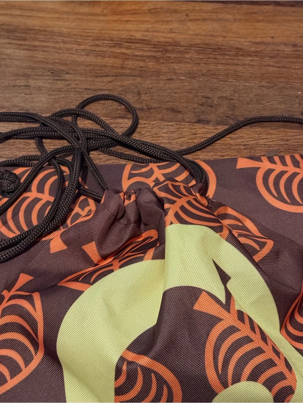 Animal Crossing Drawstring Backpack with Orange Leaf Print and Yellow Badge